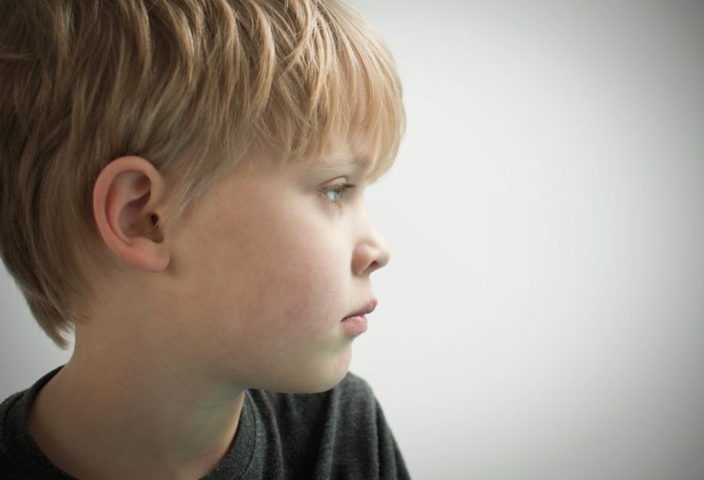 Young boy looking off camera